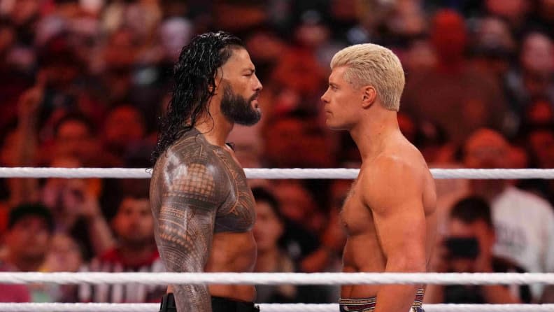 WWE superstars Roman Reigns, left, and Cody Rhodes at Wrestlemania 39.