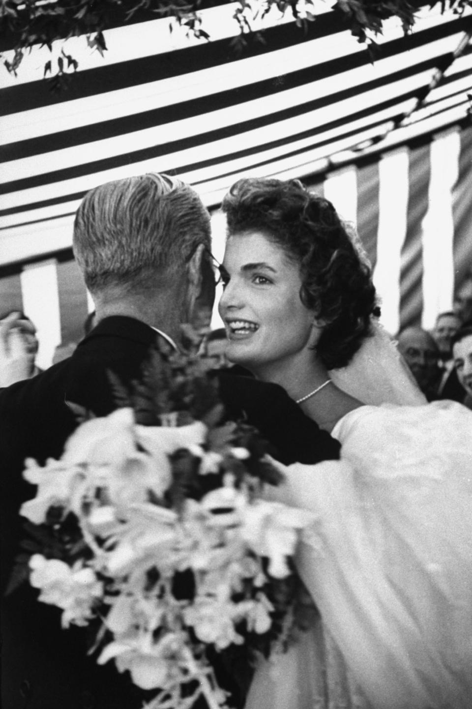 Former US Amb. to Great Britain Joseph Kennedy, dancing with son John F. Kennedy's bride, Jacqueline Bouvier Kennedy, at their wedding reception held at her mother's home. (Photo by Lisa Larsen//Time Life Pictures/Getty Images)