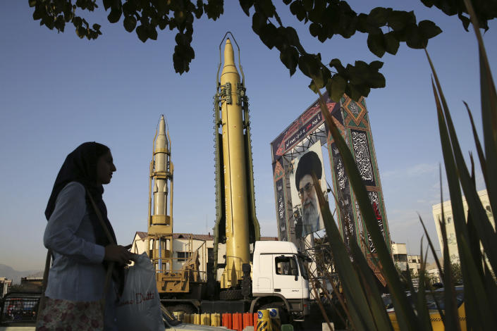 FILE - A Ghadr-H missle, center, a solid-fuel surface-to-surface Sejjil missile and a portrait of the Supreme Leader Ayatollah Ali Khamenei are on display for the annual Defense Week, marking the 37th anniversary of the 1980s Iran-Iraq war, at Baharestan Sq. in Tehran, Iran, Sept. 24, 2017. Iranian state television said Sunday, June 26, 2022, that Tehran had launched a solid-fueled rocket into space, drawing a rebuke from Washington ahead of the expected resumption of stalled talks over Tehran’s tattered nuclear deal with world powers. (AP Photo/Vahid Salemi, File)
