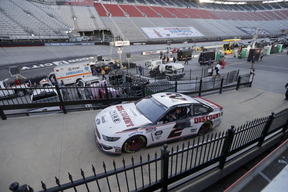 Brad Keselowski (2) drives to victory lane after winning a NASCAR Cup Series auto race at Bristol Motor Speedway Sunday, May 31, 2020, in Bristol, Tenn. (AP Photo/Mark Humphrey)