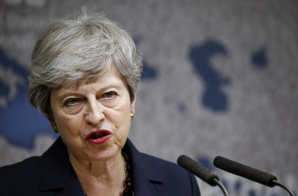 Britain's Prime Minister Theresa May speaks at Chatham House in London, Wednesday July 17, 2019. Prime Minister Theresa May says she worries about the increasing "absolutism" of world politics, in a message many will see as aimed at her successor as Britain's leader and President Donald Trump. (Henry Nicholls/Pool via AP)