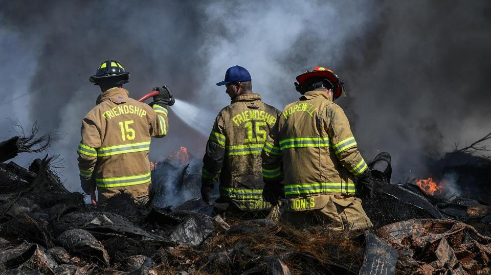 Friendship firemen from Anderson County work at the scene of a tire fire at Viva Recycling of South Carolina on S.C. 28 South in Anderson Friday morning. 