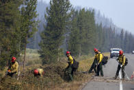 <p>Firefighters bring town dangerous trees from the area of the Berry Fire in Grand Teton National Park, Wyo., Aug 25, 2016. (AP Photo/Brennan Linsley) </p>