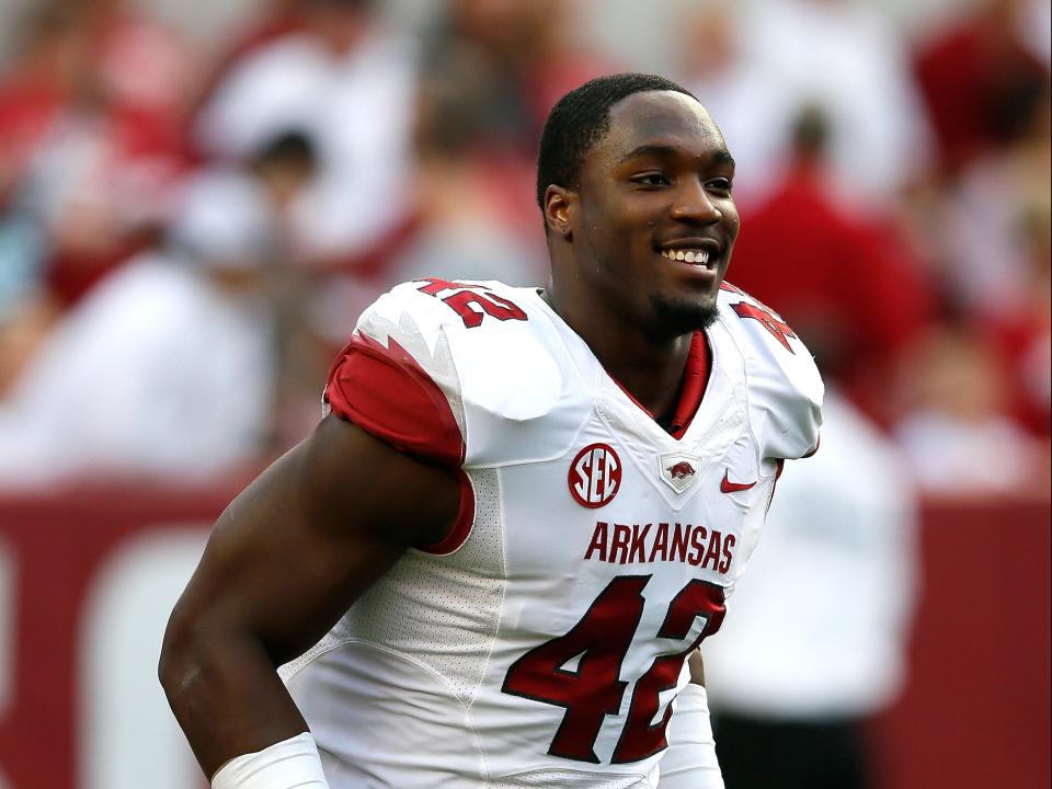 TUSCALOOSA, AL – OCTOBER 19: Chris Smith #42 of the Arkansas Razorbacks enjoys a laugh during pregame warmups prior to facing the Alabama Crimson Tide at Bryant-Denny Stadium on October 19, 2013 in Tuscaloosa, Alabama. (Photo by Kevin C. Cox/Getty Images)