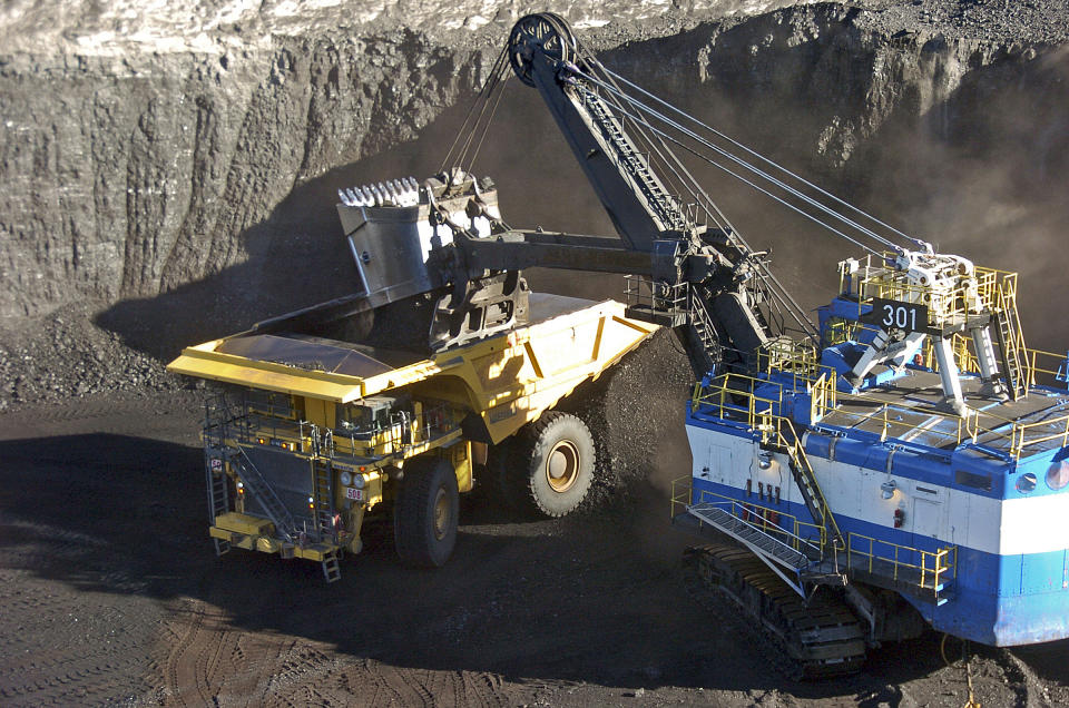 FILE - A mechanized shovel loads coal from an 80-feet thick seam into a haul truck at Cloud Peak Energy's Spring Creek mine, Nov. 15, 2016, near Decker, Mont. Republicans in Congress say a Biden administration proposal on Thursday, May 16, 2024, to stop future coal leasing in the Powder River Basin of Montana and Wyoming could harm the industry. (AP Photo/Matthew Brown, File)