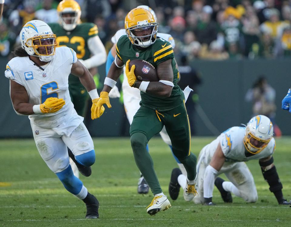 Green Bay Packers wide receiver Dontayvion Wicks (13) makes a 35-yard reception during the fourth quarter of their game Sunday, November 19, 2023 at Lambeau Field in Green Bay, Wisconsin. The Green Bay Packers beat the Los Angeles Chargers 23-20.