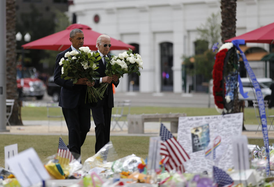 <p>President Obama and Vice President Biden take flowers to a makeshift memorial for the shooting victims of the Orlando massacre, June 16, 2016. (Carlos Barria/Reuters) </p>