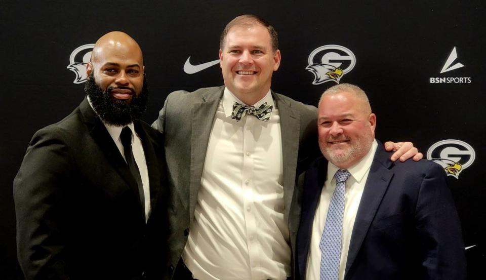 From left to right: New Gray Collegiate football coach De’Angelo Bryant, principal Brian Newsome and new athletic director Kevin Heise pose for a photo at a press conference on Feb. 13, 2024. Lou Bezjak/The State