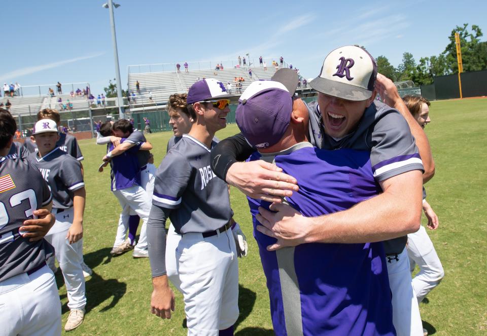 Rosepine's Ethan Frey (right) and head coach Jeff Smith celebrate after their victory over Doyle during the championship round of the LHSAA state baseball tournament at McMurray Park in Sulphur, La., Friday, May 14, 2021. (Rick Hickman/Lake Charles American Press)
