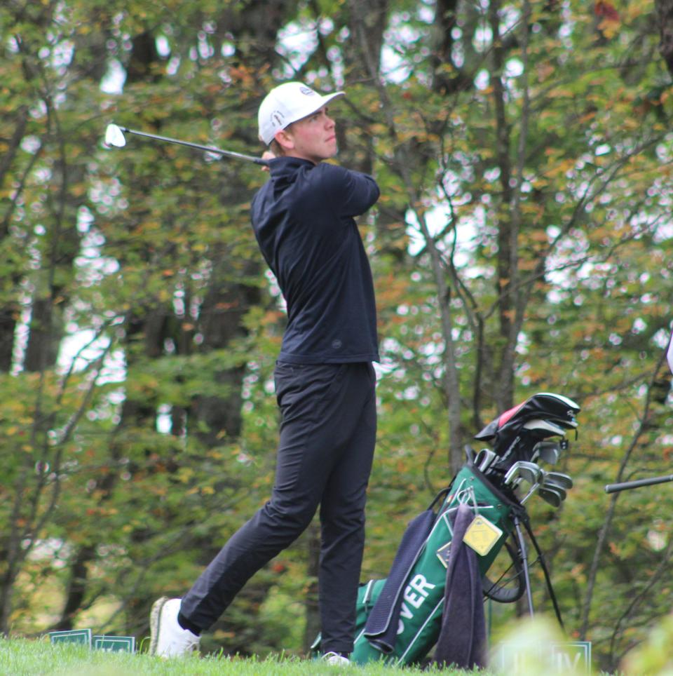 Dover's Jon Dumais watches his tee shot off a Par 3 during Tuesday's Division I tournament at Canterbury Woods Country Club.