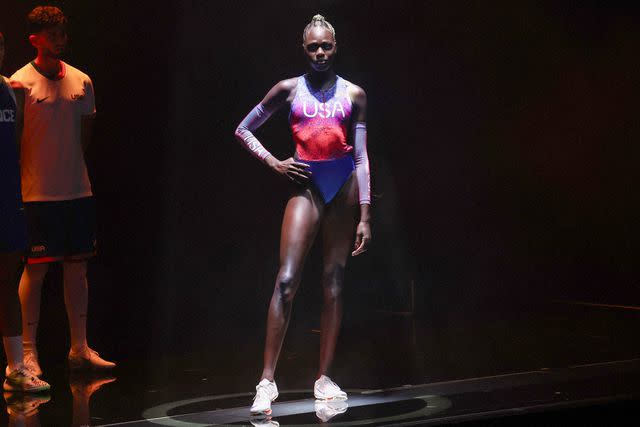 <p>EMMANUEL DUNAND/AFP via Getty</p> Athing Mu models a Nike Olympics uniform