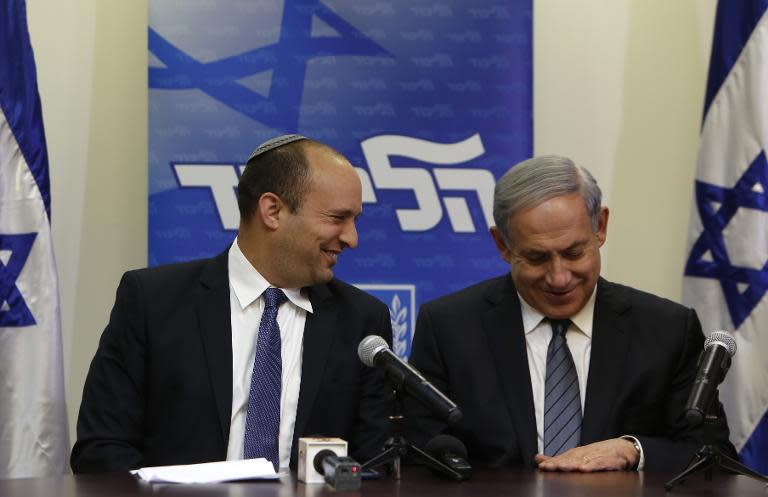 Israeli Prime Minister Benjamin Netanyahu (R) and the head of the right-wing Jewish Home party at a press conference announcing formation of coalition government and agreement with Jewish Home