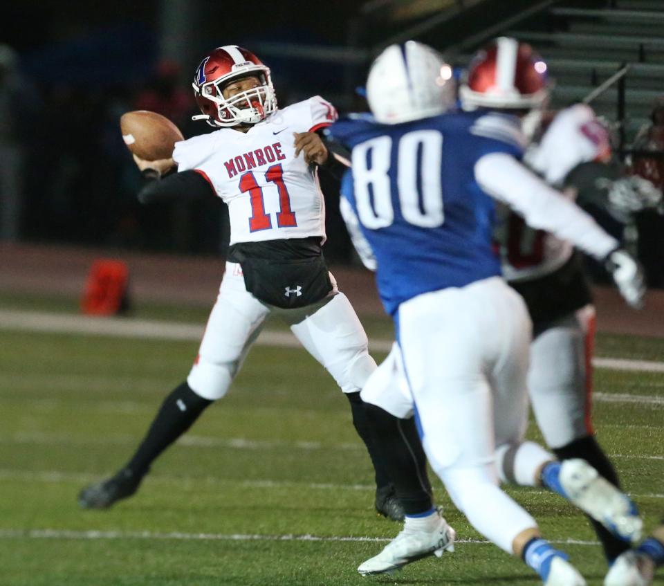 Monroe quarterback Khaya Moses (11) throws a long touchdown pass to Landan McKnight during their Section V football Class B championship game Saturday, Nov. 12, 2022 at SUNY Brockport.