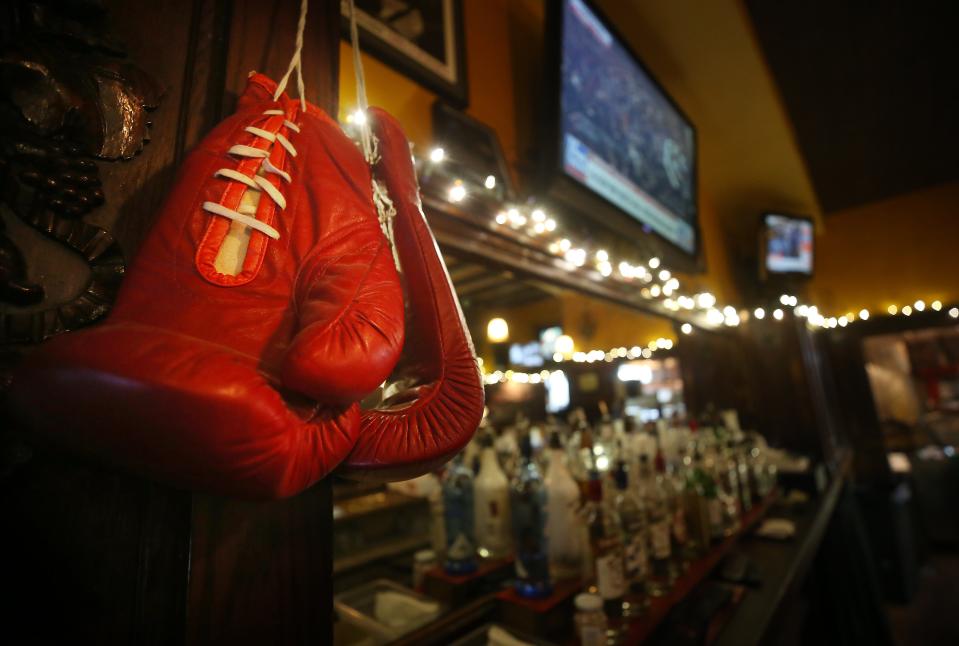 Boxing gloves adorn the bar at the Ringside Café.
