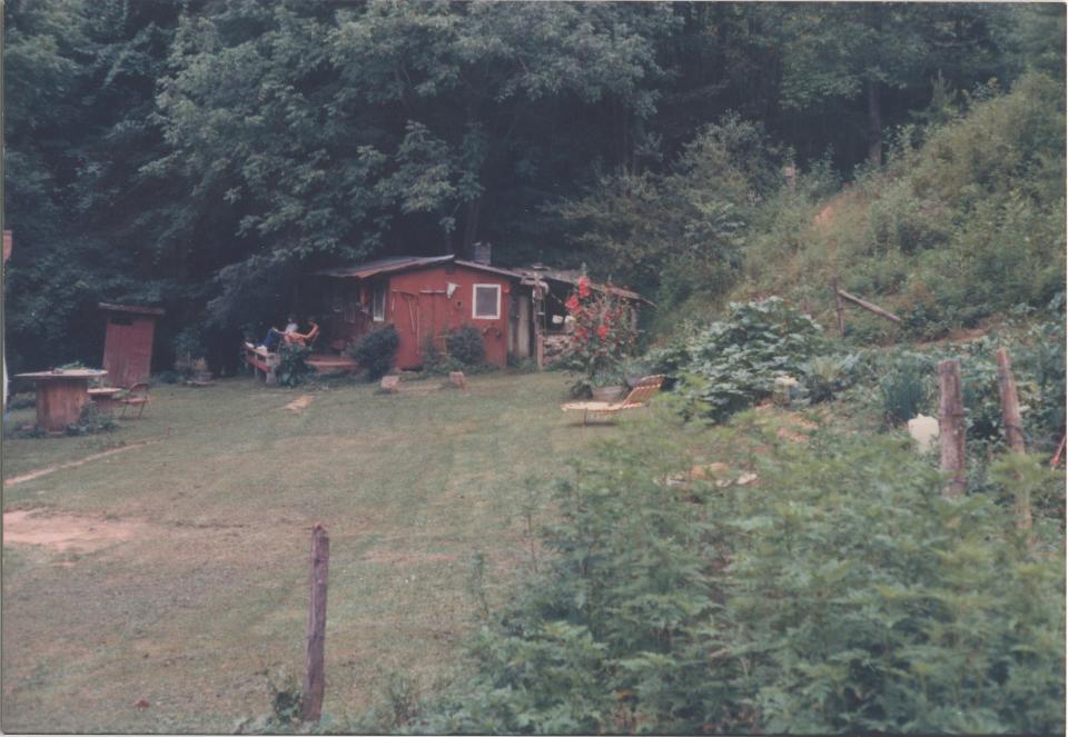 The original cabin on Ellison property, Lower Land’s Creek, about 1988. Elizabeth and Quintin Ellison are on the porch.