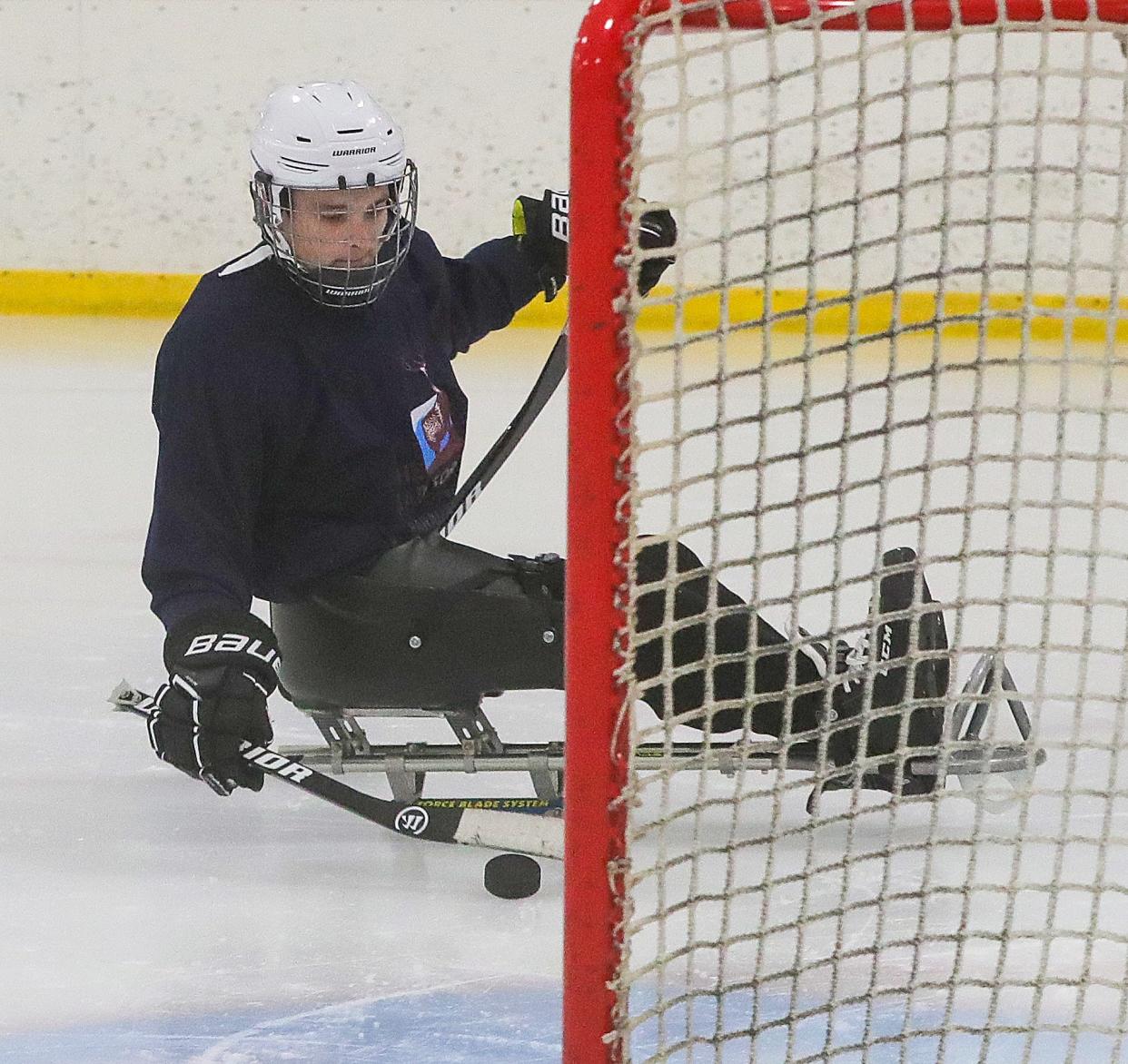 Canton Tuskies player Jacob Baker shoots into the net during a practice at the Center Ice Sports Complex on Monday, Feb. 19, 2024.