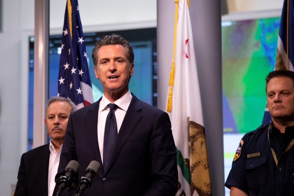 California Governor Gavin Newsom answered questions at a press conference Thursday evening, at the Office of Emergency Services outside Sacramento, Calif., about how the state would address unprecedented power outages planned by utility company PG&E