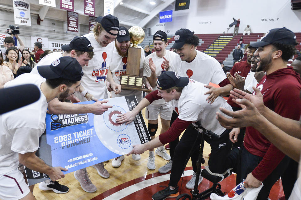 Colgate players punch their ticket to the March Madness tournament after their win against Lafayette in an NCAA college basketball game for the Patriot League tournament championship in Hamilton, N.Y., Wednesday, March 8, 2023. (AP Photo/Adrian Kraus)