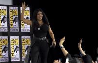 Salma Hayek waves to the fans as she walks on stage at the Marvel Studios panel on day three of Comic-Con International on Saturday, July 20, 2019, in San Diego. (Photo by Chris Pizzello/Invision/AP)