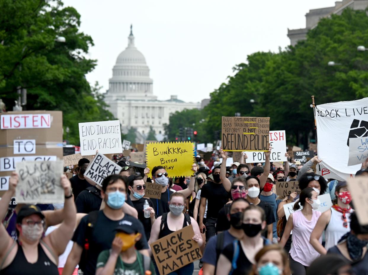 FILE PHOTO: Demonstrators march from the U.S. Capitol Building during a protest against racial inequality in the aftermath of the death in Minneapolis police custody of George Floyd, in Washington, U.S., June 6, 2020. REUTERS/Erin Scott/File Photo