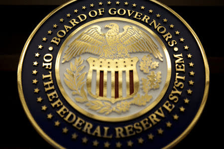 FILE PHOTO: The seal for the Board of Governors of the Federal Reserve System is on display in Washington, DC, U.S., June 14, 2017. REUTERS/Joshua Roberts/File Photo