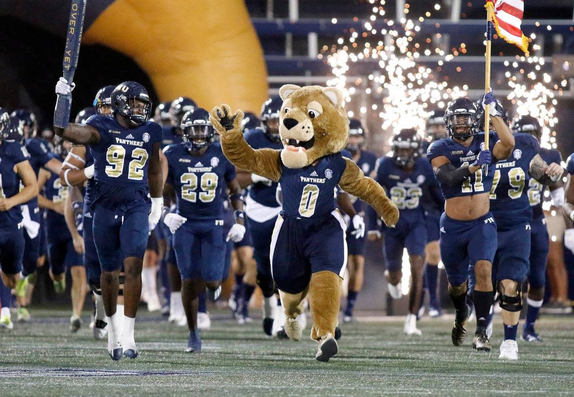 FIU Panthers led by Roary take the field for the game against the Western Kentucky Hilltoppers Saturday, Oct. 23, 2021, at Riccardo Silva Stadium in Miami.