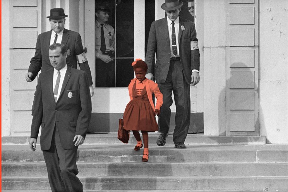 U.S. Deputy Marshals escort 6-year-old Ruby Bridges from William Frantz Elementary School in New Orleans, in this November 1960, file photo.