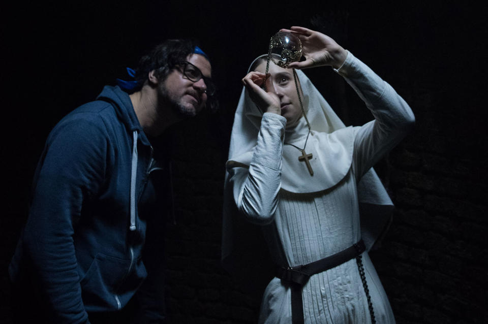 (L-R) Director Corin Hardy and Taissa Farmiga on the set of New Line Cinema’s horror film <i>The Nun</i>, a Warner Bros. Pictures release. (© 2018 WARNER BROS. ENTERTAINMENT INC.)