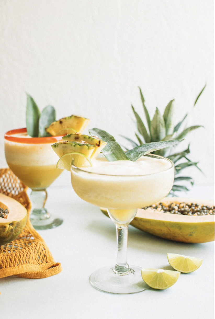 Two frozen pineapple papaya margaritas.