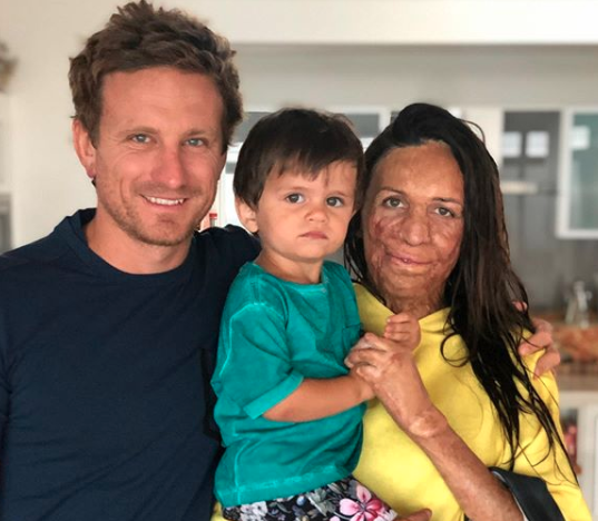 Turia Pitt with husband Michael Hoskin (left) and son Hakavai Hoskin (held)