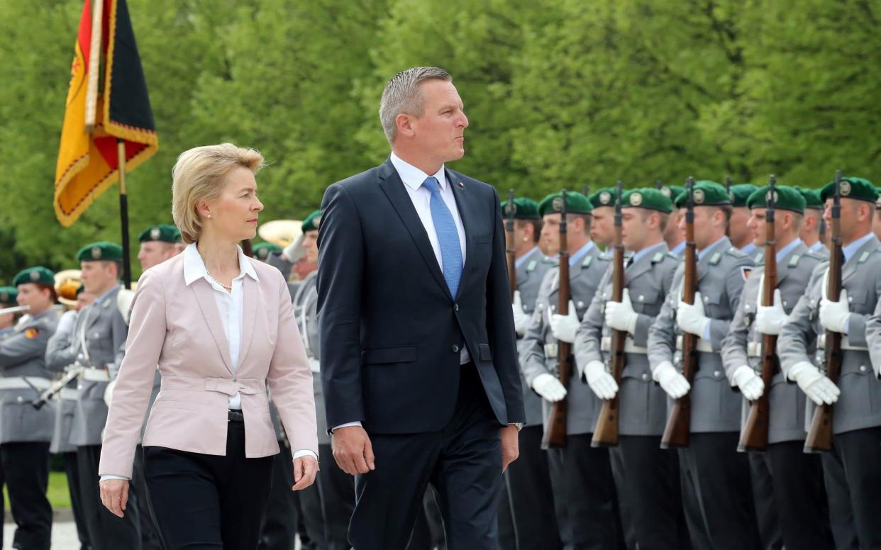 German Defence Minister Ursula von der Leyen  and Austrian Defence Minister Mario Kunasek review the honour guard during a welcoming ceremony on April 23 - DPA