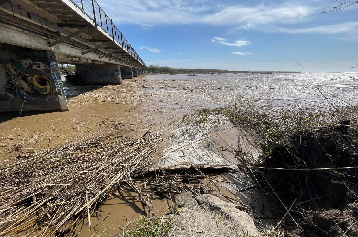 Water rushes under the Santa Clara River bridge along Harbor Boulevard on Wednesday after recent rain.