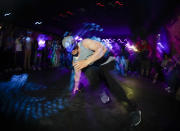 A dancer warms up before a competition hosted by Supreme Beingz at the Mercury Lounge Friday, June 7, 2019, in New York. Many in the breaking community are eager for the art form to expand its audience after the International Olympic Committee announced that it would become an official sport at the Paris 2024 games. But that optimism is hardly unanimous. (AP Photo/Frank Franklin II)