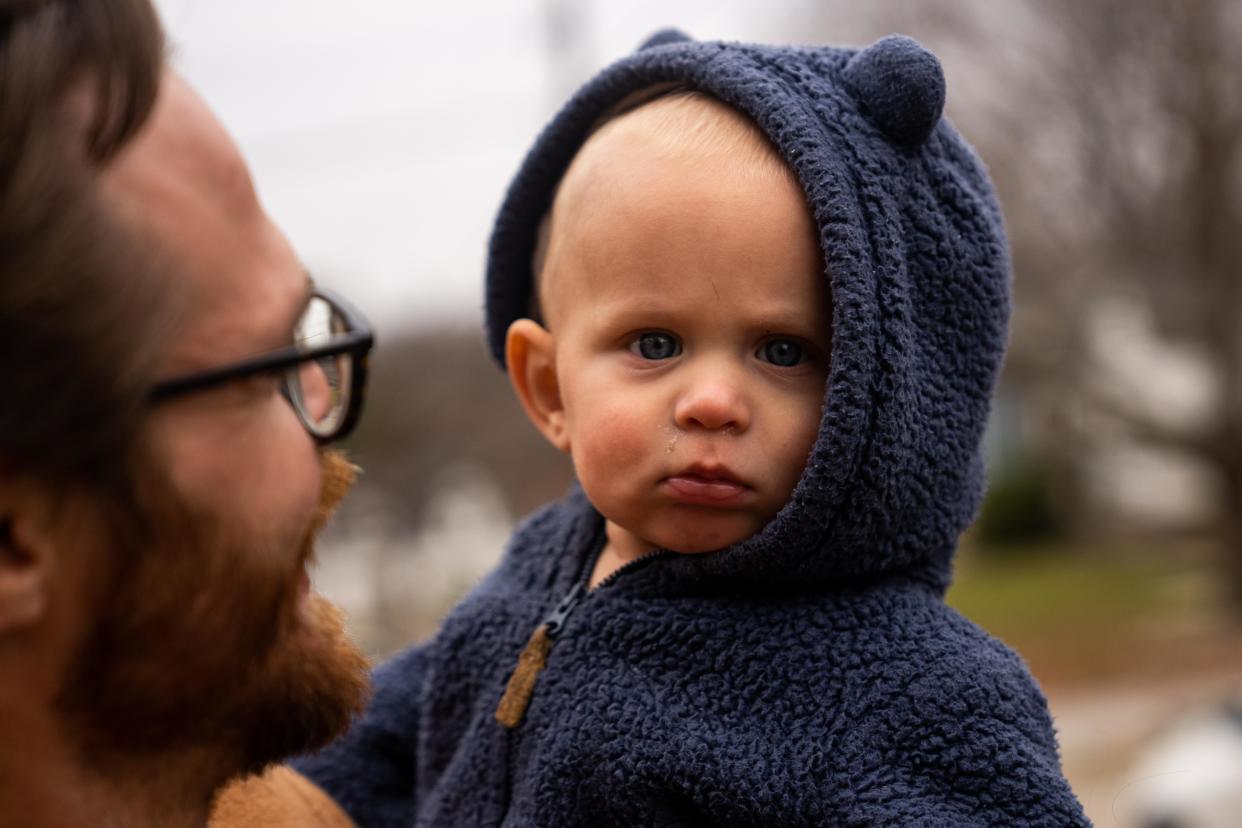 Paul Donlin, 9 months, looks to the camera as he and his family take a walk Tuesday, Dec. 5, 2023, in Des Moines. After Paul's birth, the umbilical cord was screened in a nonconsensual drug test, which came back positive for cocaine. The family claims the test results were a false positive.