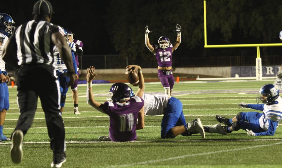 Irion County High School's Trevin Coffell (11) reacts after scoring a touchdown against Eden in a District 14-1A Division I football game Friday, Nov. 5, 2021 at O.K. Wolfenbarger Field in Mertzon.