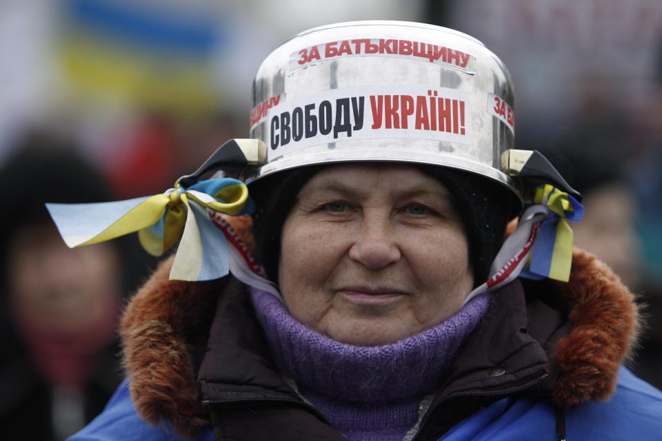 Valentina, a 64-year-old pensioner from Kiev, poses for a picture at the barricades in Kiev
