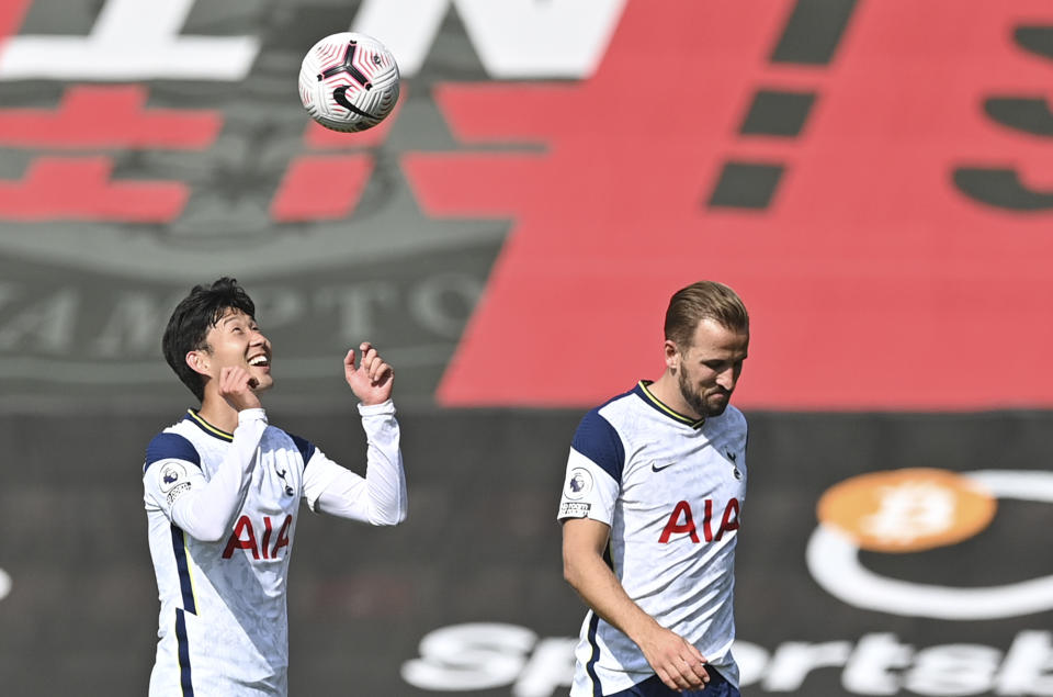 Tottenham's Son Heung-min, left, and Tottenham's Harry Kane celebrate at the end of the English Premier League soccer match between Southampton and Tottenham Hotspur at St. Mary's Stadium in Southampton, England, Sunday, Sept. 20, 2020. (Justin Tallis/Pool via AP)