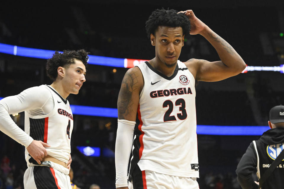 Georgia center Braelen Bridges (23) and guard Jusaun Holt turn to walk off the court after an NCAA college basketball game in the first round of the Southeastern Conference tournament, Wednesday, March 8, 2023, in Nashville, Tenn. LSU won 72-67. (AP Photo/John Amis)