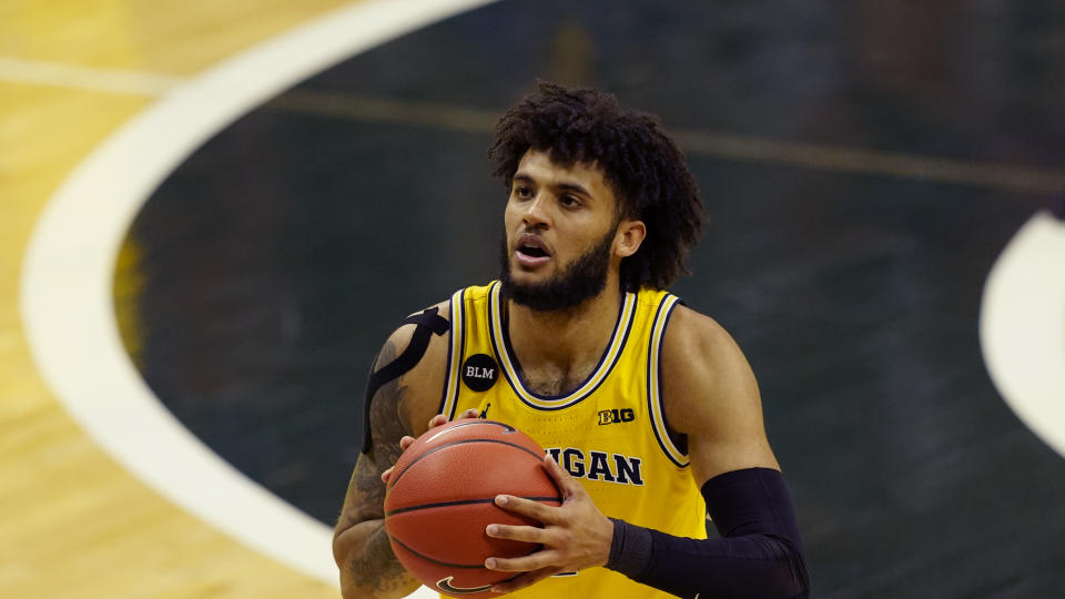 Michigan forward Isaiah Livers plays during the first half of an NCAA college basketball game, Sunday, March 7, 2021, in East Lansing, Mich. (AP Photo/Carlos Osorio)