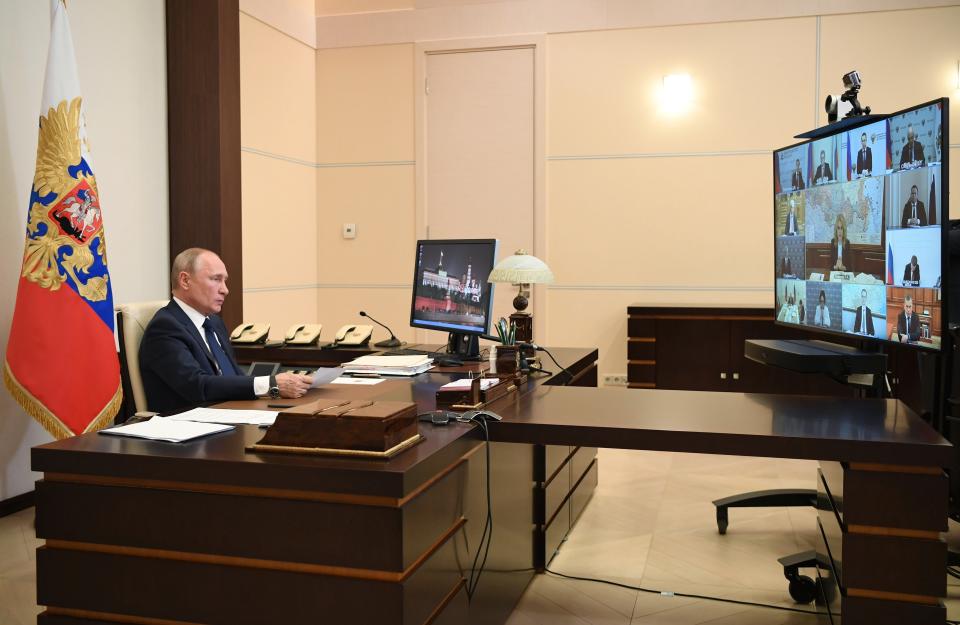 Russian President Vladimir Putin, addresses the nation via video conference at the Novo-Ogaryovo residence outside Moscow, Russia, Monday, May 11, 2020. Putin, speaking in a televised address to the nation Monday, said that it will be up to the governors of Russia's far-flung to determine what industrial plants could reopen starting Tuesday. He emphasized that it's essential to preserve jobs and keep the economy running provided that workers strictly observe sanitary norms.(Alexei Nikolsky, Sputnik, Kremlin Pool Photo via AP)