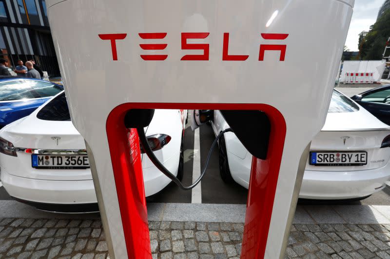 FILE PHOTO: Tesla managers demonstrate V3 superchargers on German research campus in Berlin