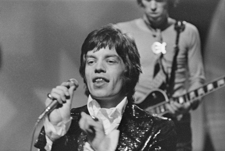 Musician Brian Jones (1942 - 1969) of the Rolling Stones during the group's appearance on the Eamonn Andrews TV show, February 1967. Keith Richards is visible behind. (Photo by Larry Ellis/Express/Getty Images)