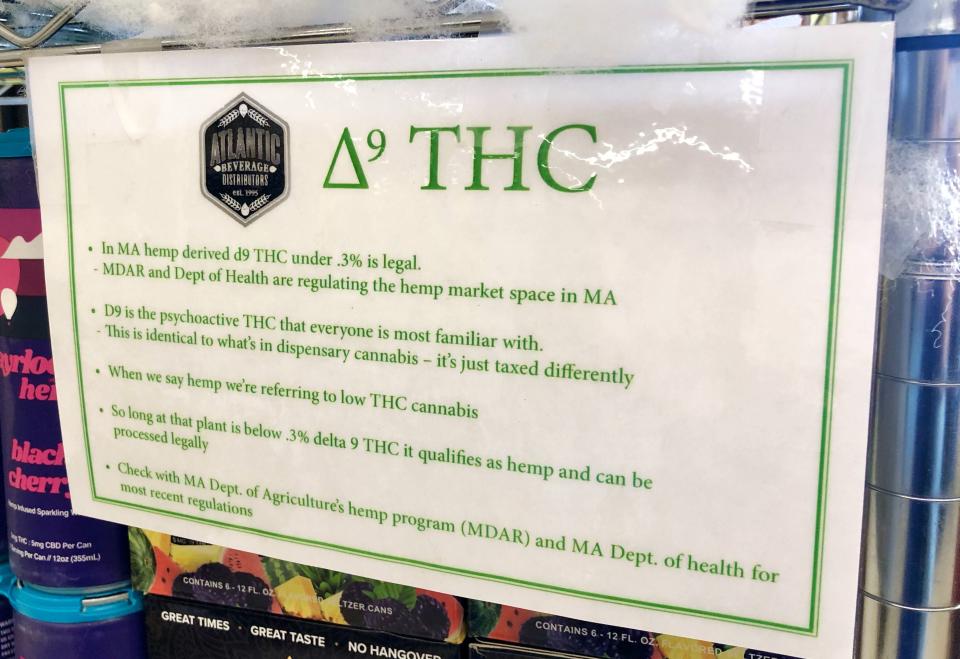 A sign attached to the shelf packed with delta-9 THC beverages at Yankee Spirits in Sturbridge explains why they're legal.