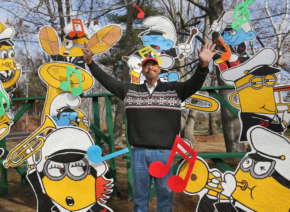 Al Bailey of Portsmouth, see Thursday, Dec. 15, 2022, is surrounded by characters in a band he created as part of one of his annual holiday displays. He says 2022 is the final year he is creating new displays.