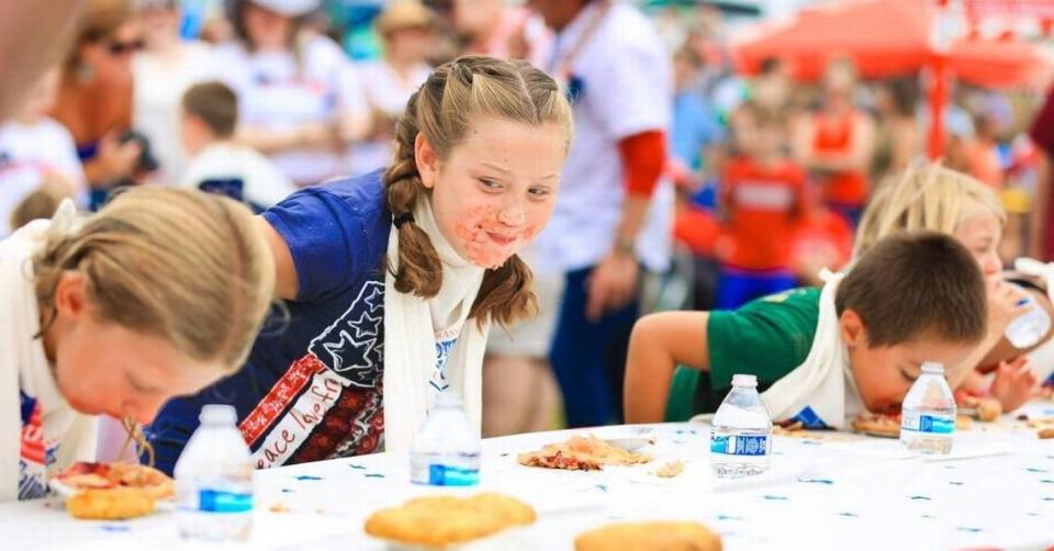 Kids compete in a pie-eating contest during Fourth of July events at Shamel Park in Cambria in 2017.