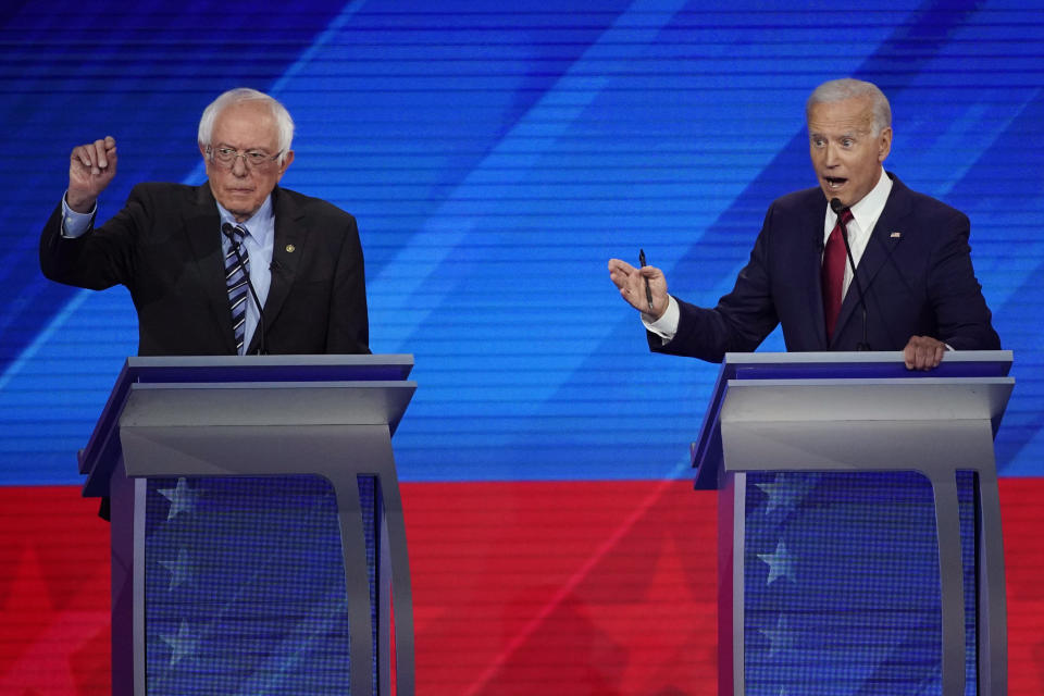 Sen. Bernie Sanders, I-Vt., left, and former Vice President Joe Biden, right, speak Thursday, Sept. 12, 2019, during a Democratic presidential primary debate hosted by ABC at Texas Southern University in Houston. (AP Photo/David J. Phillip)