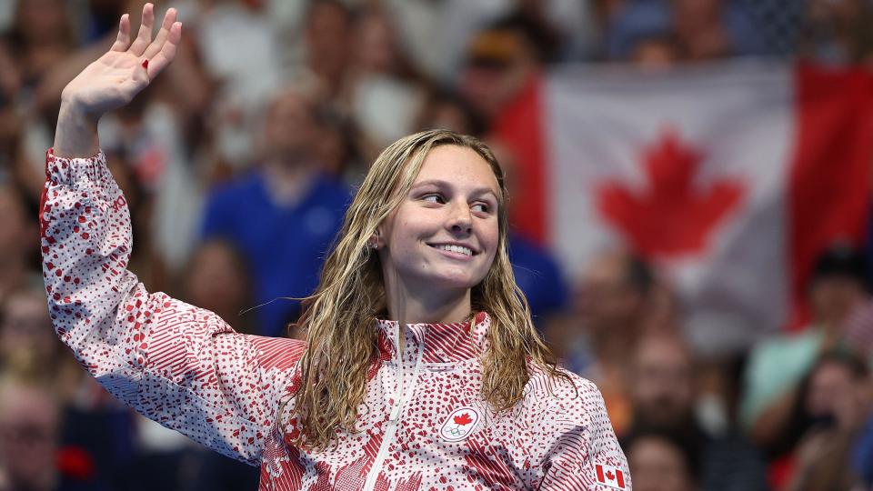 Canada's Summer McIntosh waves to the crowd