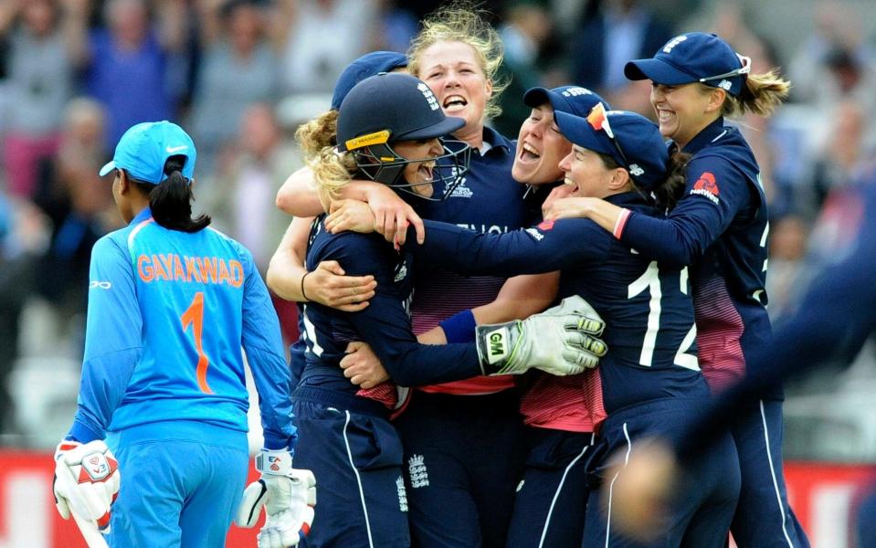 England's Anya Shrubsole, centre, celebrates with teammates as England win the ICC Women's World Cup 2017 final against India at Lord's - Credit: AP