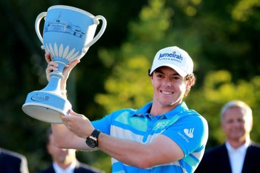 Rory McIlroy of Northern Ireland holds up the trophy after winning the Deutsche Bank Championship at TPC Boston in Norton, Massachusetts