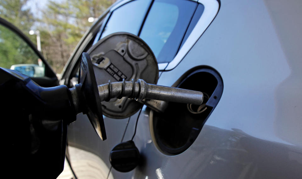 FILE- In this April 23, 2018, file photo a car is filled with gasoline at a station in Windham, N.H. Conserving oil is no longer an economic imperative for the U.S., the Trump administration declares in a major new policy statement that threatens to undermine decades of government campaigns for gas-thrifty cars and other conservation programs. (AP Photo/Charles Krupa, File)